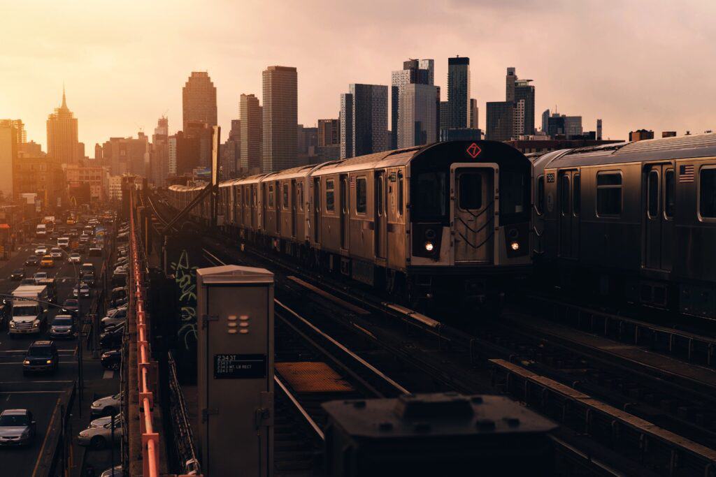 Train line with city skyline in the background.