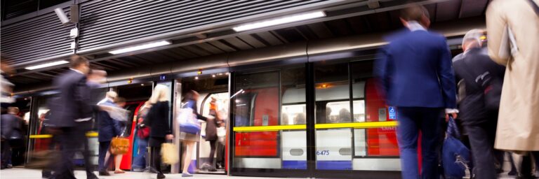 Passengers boarding a London Underground train.