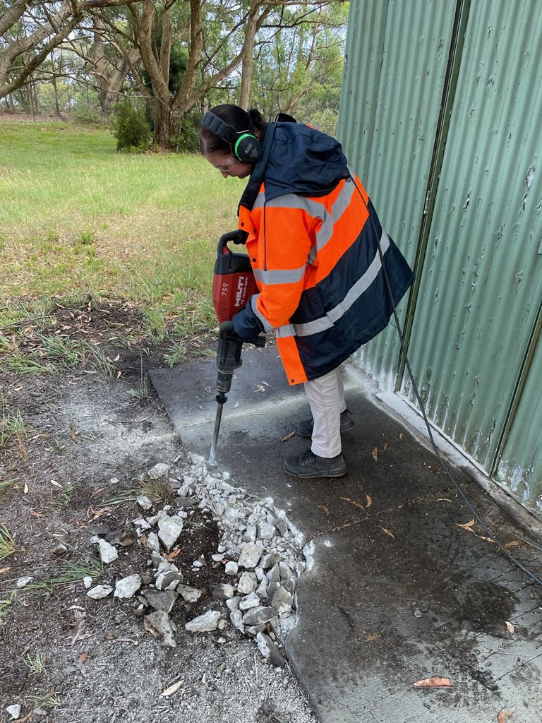 Anna Kosiba - Broadcast Technician pictured jack hammering