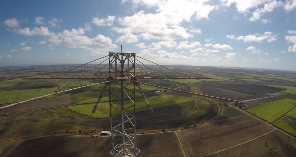 Aerial view from the top of a transmission tower looking over farming country.