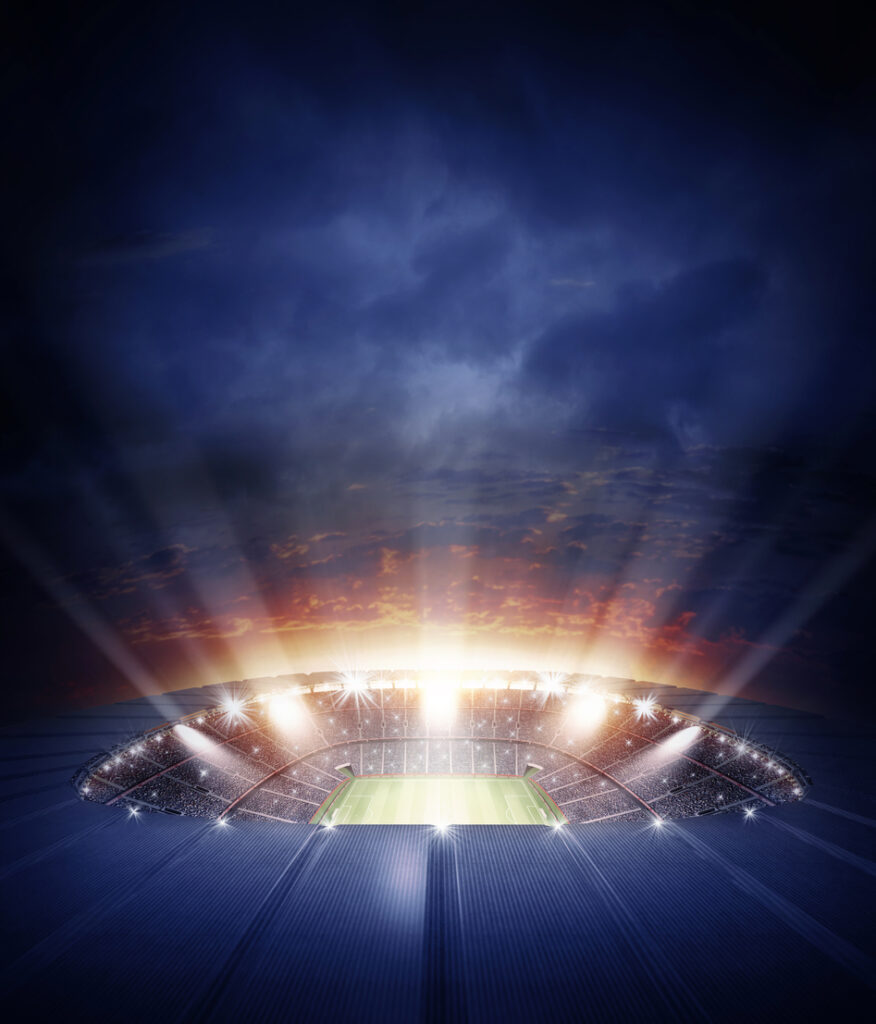 The imaginary sports stadium is modelled, rendered and illuminated against an evening sky.