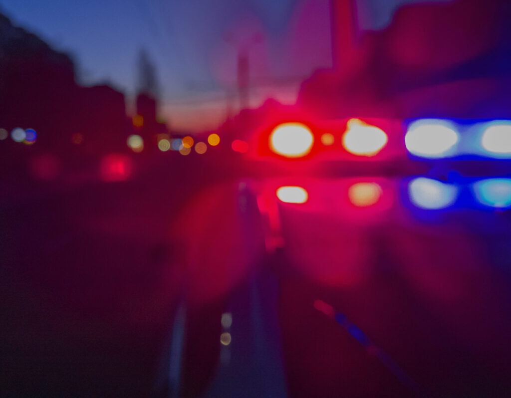 Abstract close up image of car tail lights at night.