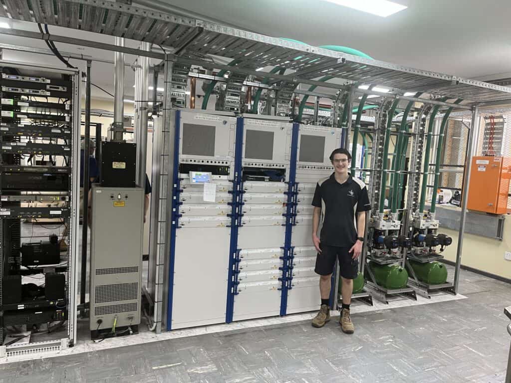 Ben a BAI Broadcast Technician pictured inside a broadcast control room.